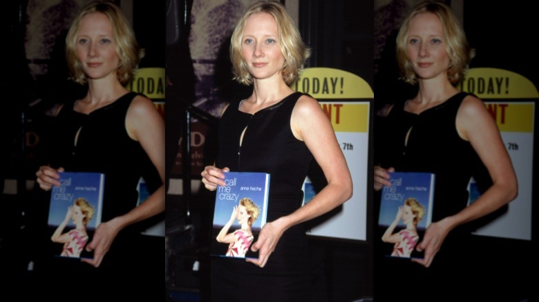 Anne Heche holding her first book