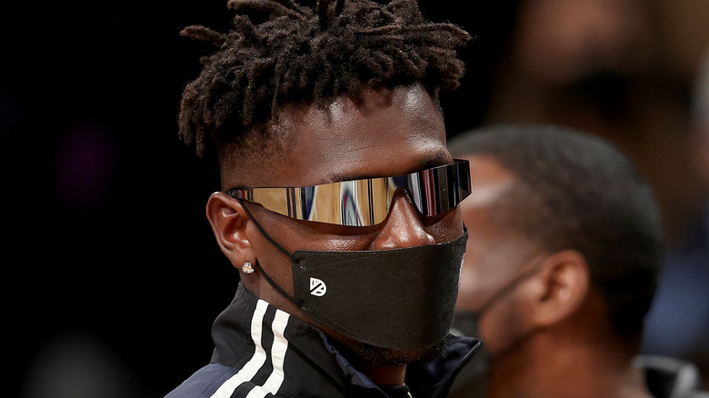 Antonio Brown wearing sunglasses and face mask