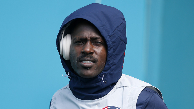 Antonio Brown wearing headphones and hoodie