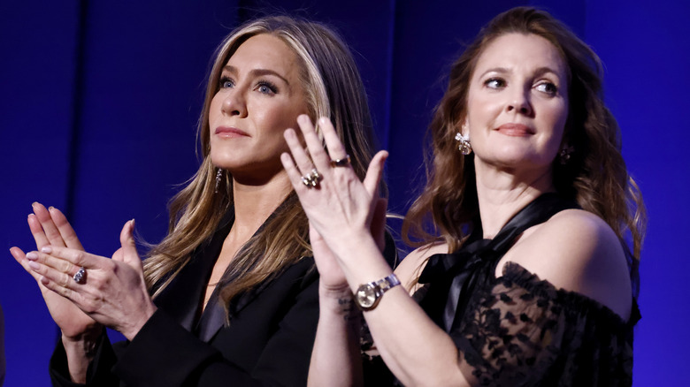 Jennifer Aniston and Drew Barrymore clapping