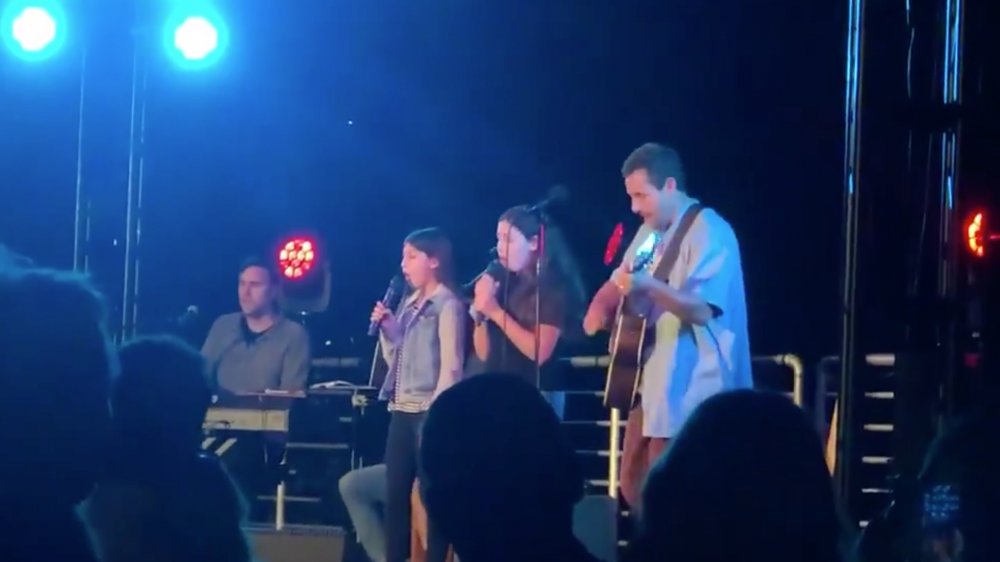 Adam Sandler performs with his daughters