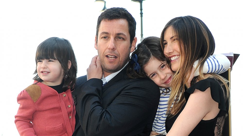 Adam Sandler and his wife and daughters