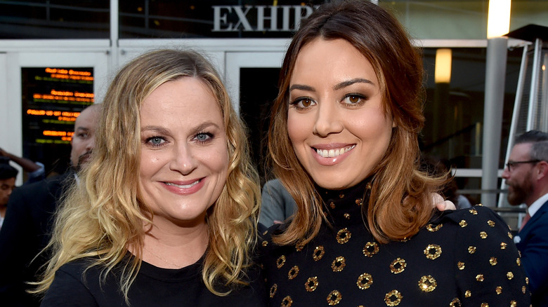 Amy Poehler and Aubrey Plaza smiling