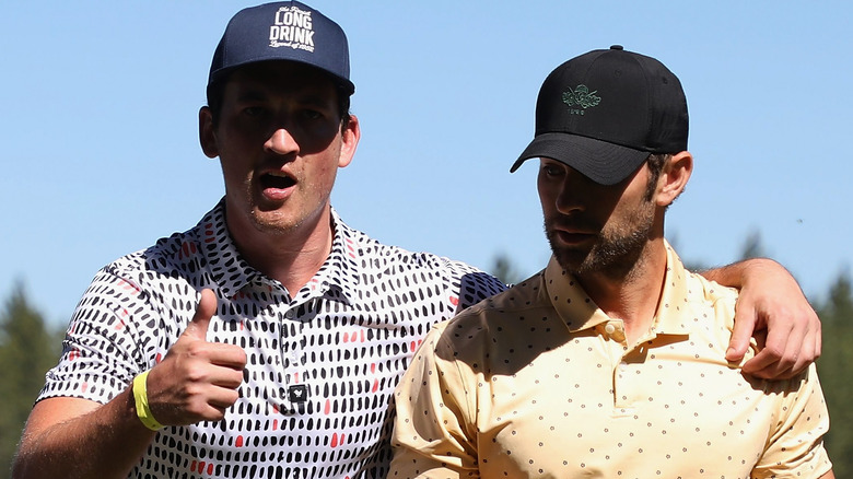 Miles Teller and Chace Crawford playing golf