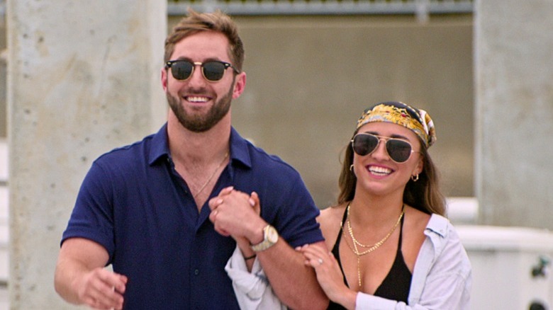 Matt and Colleen smile during yacht date