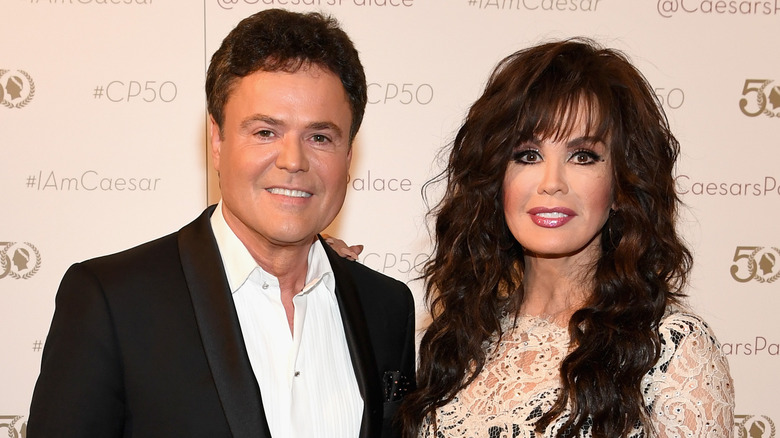 Donny and Marie Osmond smiling red carpet