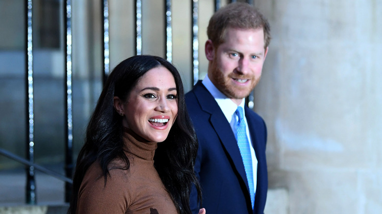 Prince Harry and Meghan Markle smiling