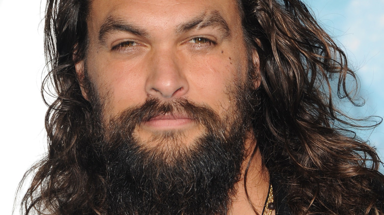 Jason Momoa posing for photo