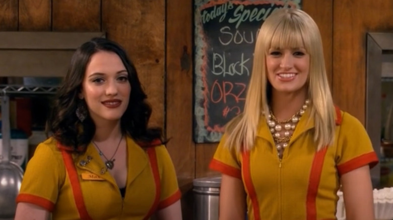 Kat Dennings, Beth Behrs wearing waitress costumes