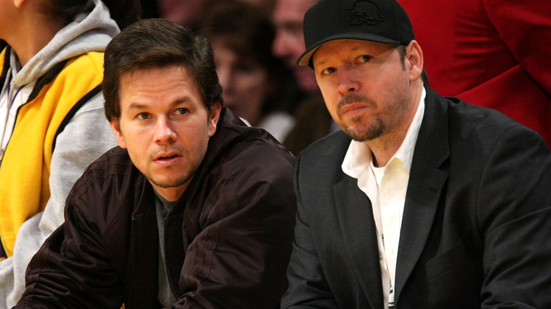 Mark Wahlberg and Donnie Wahlberg watching a game 