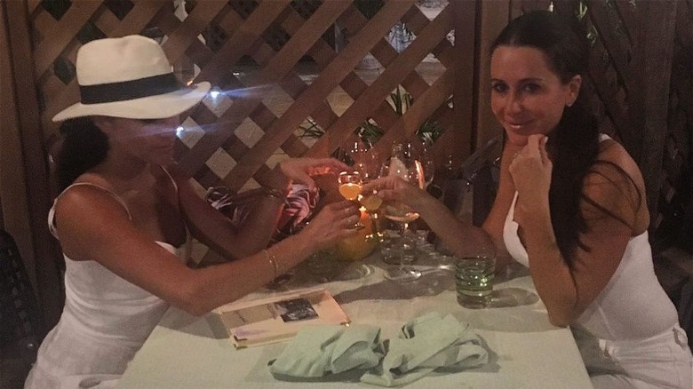 Meghan Markle and Jessica Mulroney dining together outdoors