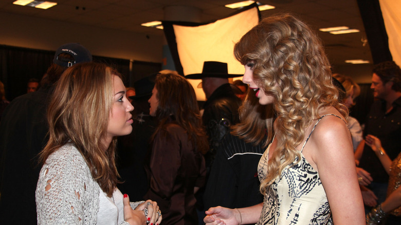 Miley Cyrus and Taylor Swift talking