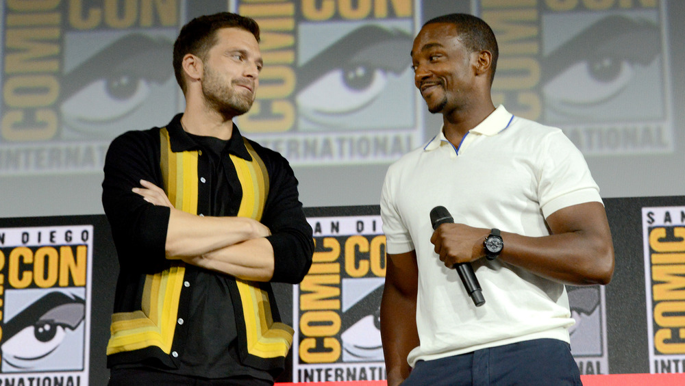 Sebastian Stan and Anthony Mackie smiling at each other at 2019 Comic-Con
