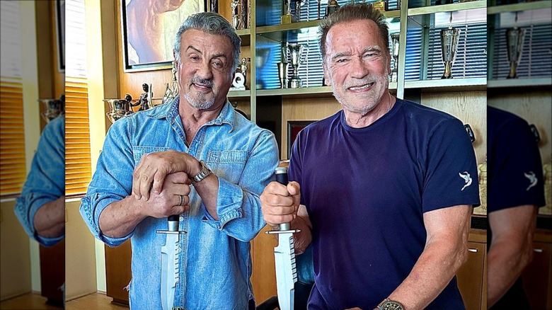 Sylvester Stallone and Arnold Schwarzenegger carve pumpkins