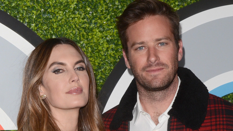 Elizabeth Chambers and Armie Hammer, posing