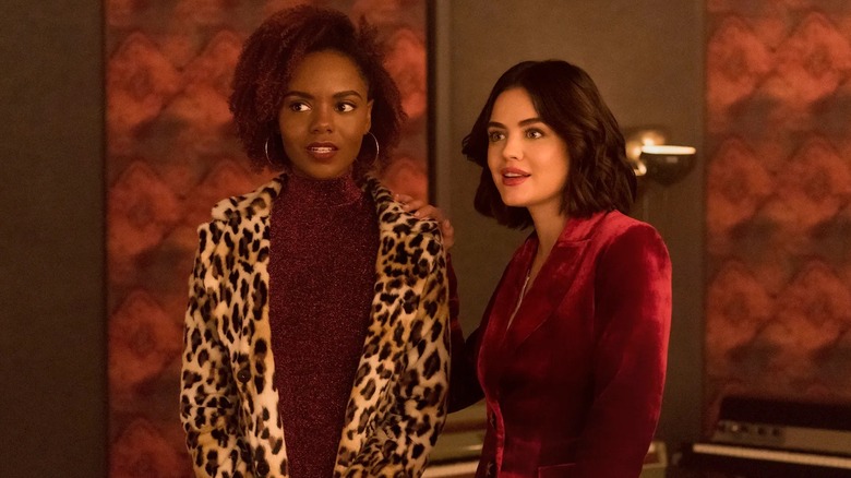 Ashleigh Murray and Lucy Hale standing