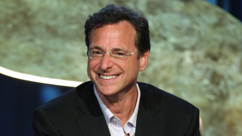 Bob Saget smiling on stage at the "Comedy Central Roast Of Bob Saget"