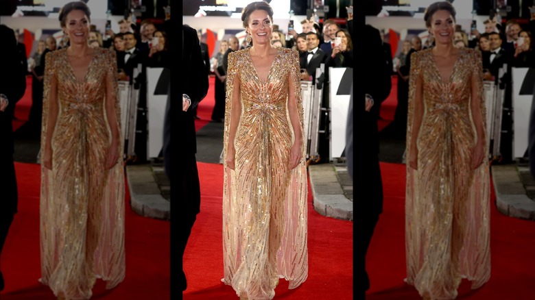 Kate Middleton wearing gold dress on the red carpet at the "No Time To Die" premiere