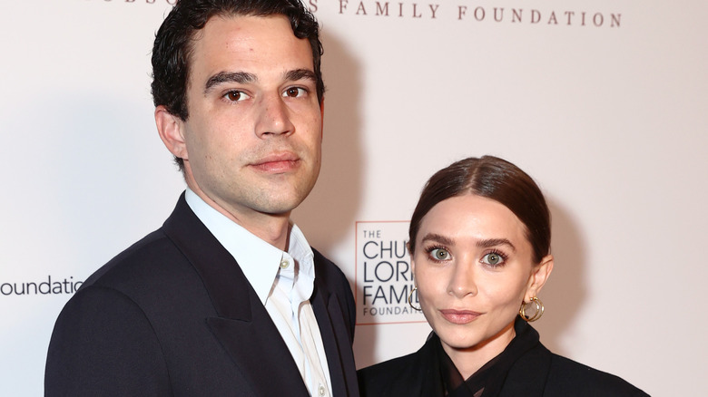 Louis Eisner and Ashley Olsen pose on the red carpet