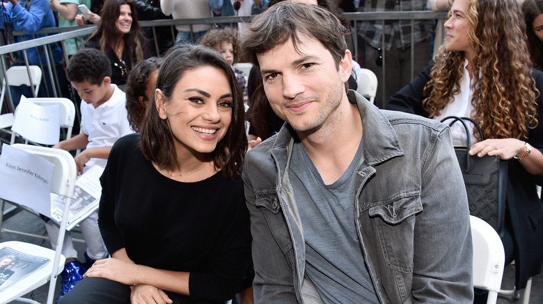 Mila Kunis and Ashton Kutcher at a event 