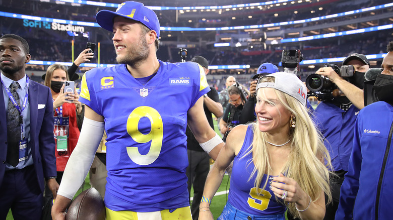 Matthew and Kelly Stafford on football field 