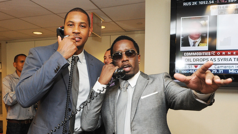 Carmelo Anthony and P Diddy posing together at the BGC office