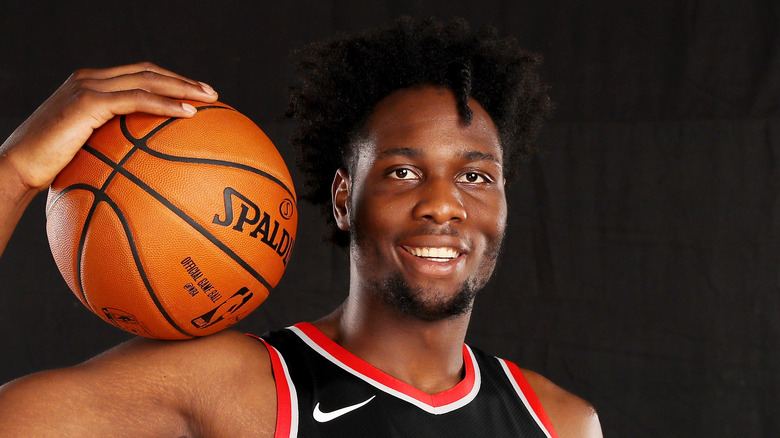 Caleb Swanigan posing with a basketball