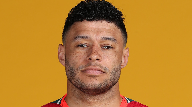 Alex Oxlade-Chamberlain poses for a photo