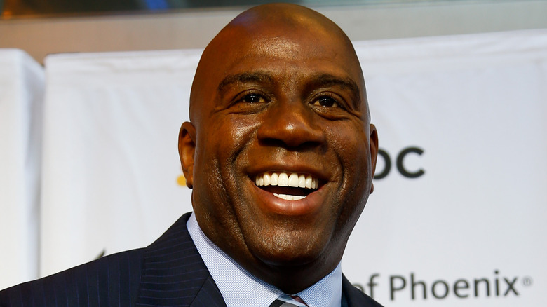 Magic Johnson smiling, looking up