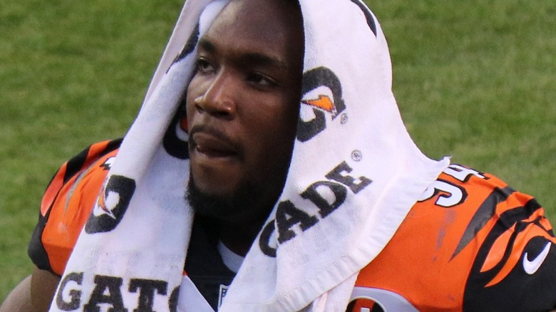 Chris Smith looking up with towel on head