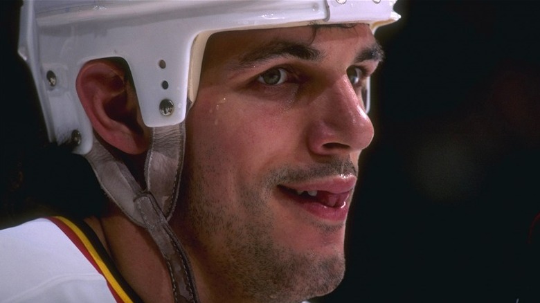 Gino Odjick in Vancouver in 1996 hockey helmet  jersey