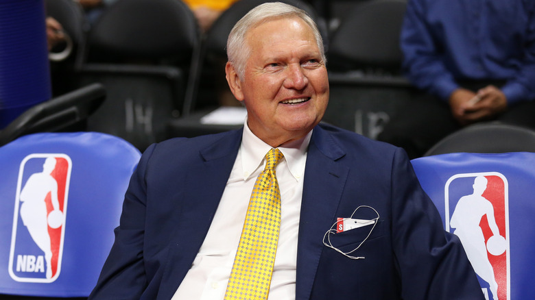 Jerry West sitting courtside