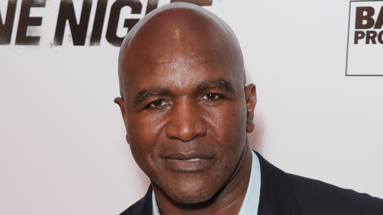 Evander Holyfield at an event, posing