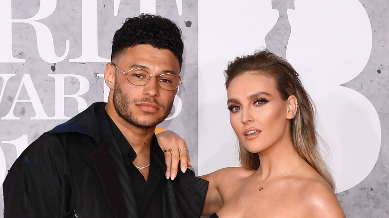 Perrie Edwards and Alex Oxlade-Chamberlain posing