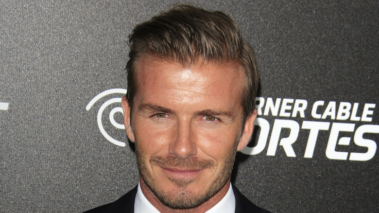 David Beckham at an event, smiling