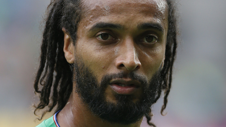 Benoit Assou-Ekotto in a green jersey