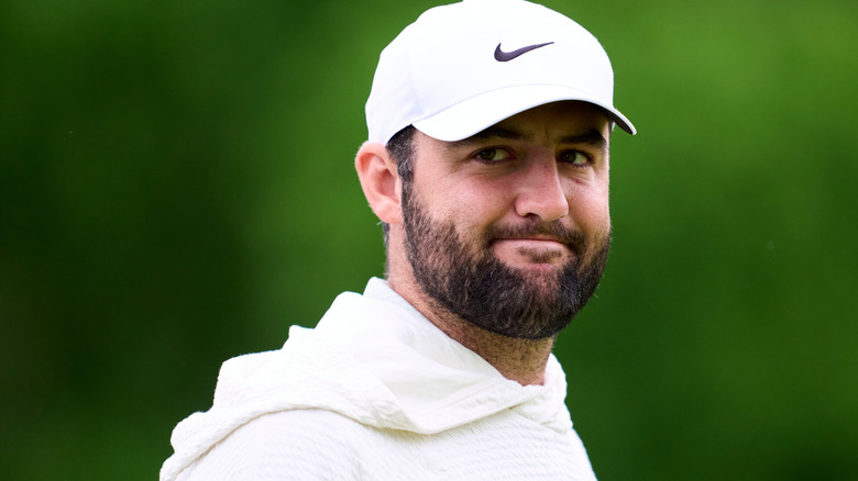 Scottie Scheffler smiling during a practice round before his arrest at the 2024 PGA Championship in Kentucky