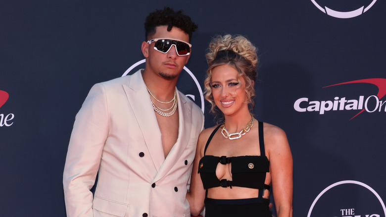 Patrick Mahomes, posing with his wife Brittany Mahomes