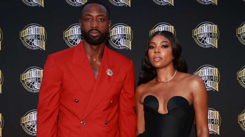 Dwyane Wade and Gabrielle Union posing together at an event