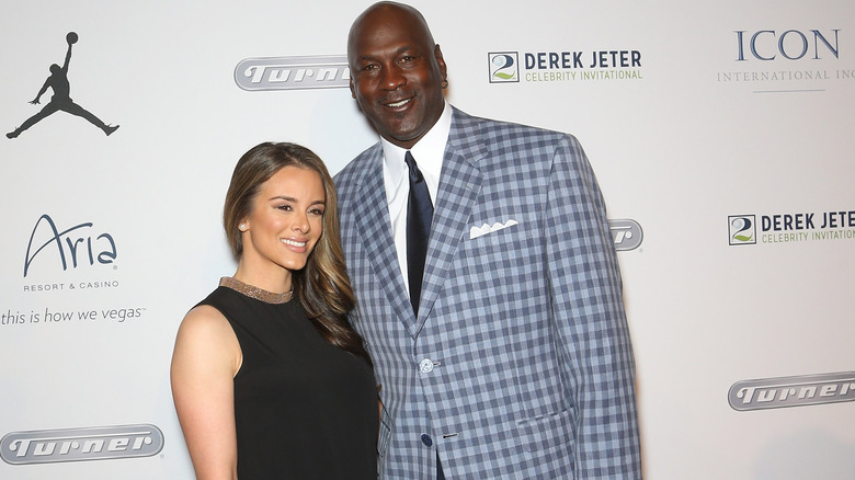 Michael Jordan and his wife posing together at an event