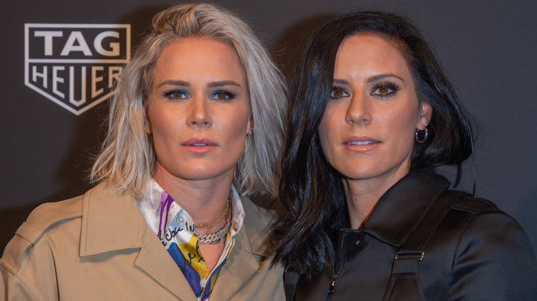 Ashlyn Harris and Ali Krieger, both posing