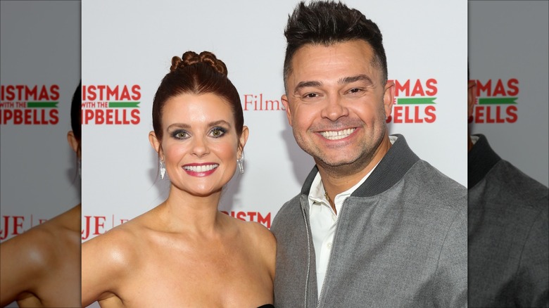 Nick Swisher and JoAnna Garcia Swisher smiling in Hollywood in 2022