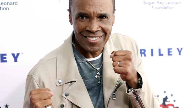 Sugar Ray Leonard smiling with fists up