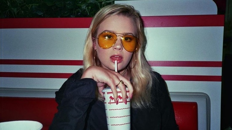 Ava Phillippe holding drink cup