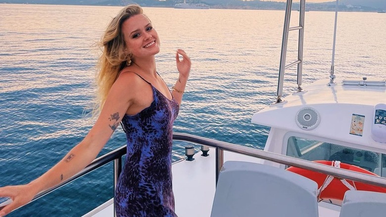 Ava Phillippe smiling on a boat