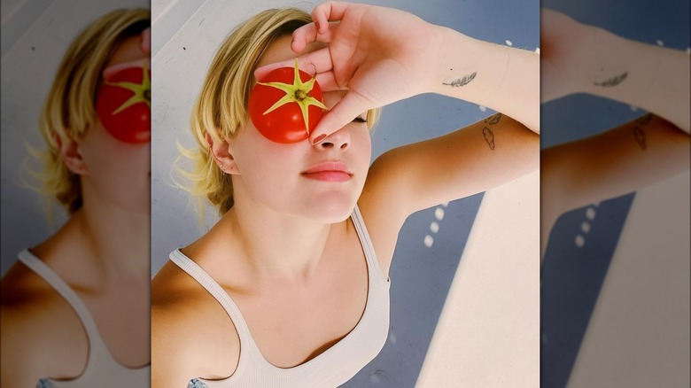 Ava Phillippe takes a selfie with a tomato