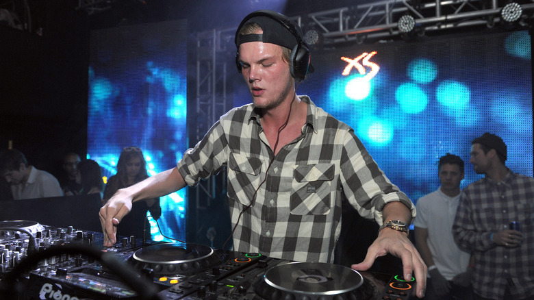 Avicii DJing in 2013.