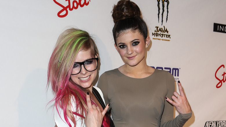 Avril Lavigne posing on the red carpet with Kylie Jenner