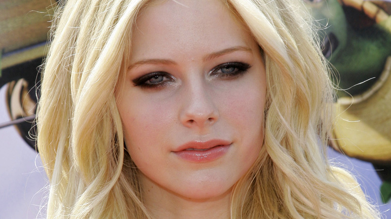 Avril Lavigne looking on