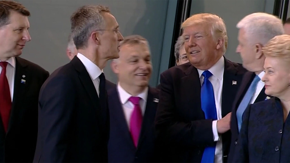 Donald Trump passing Dusko Markovic at NATO summit
